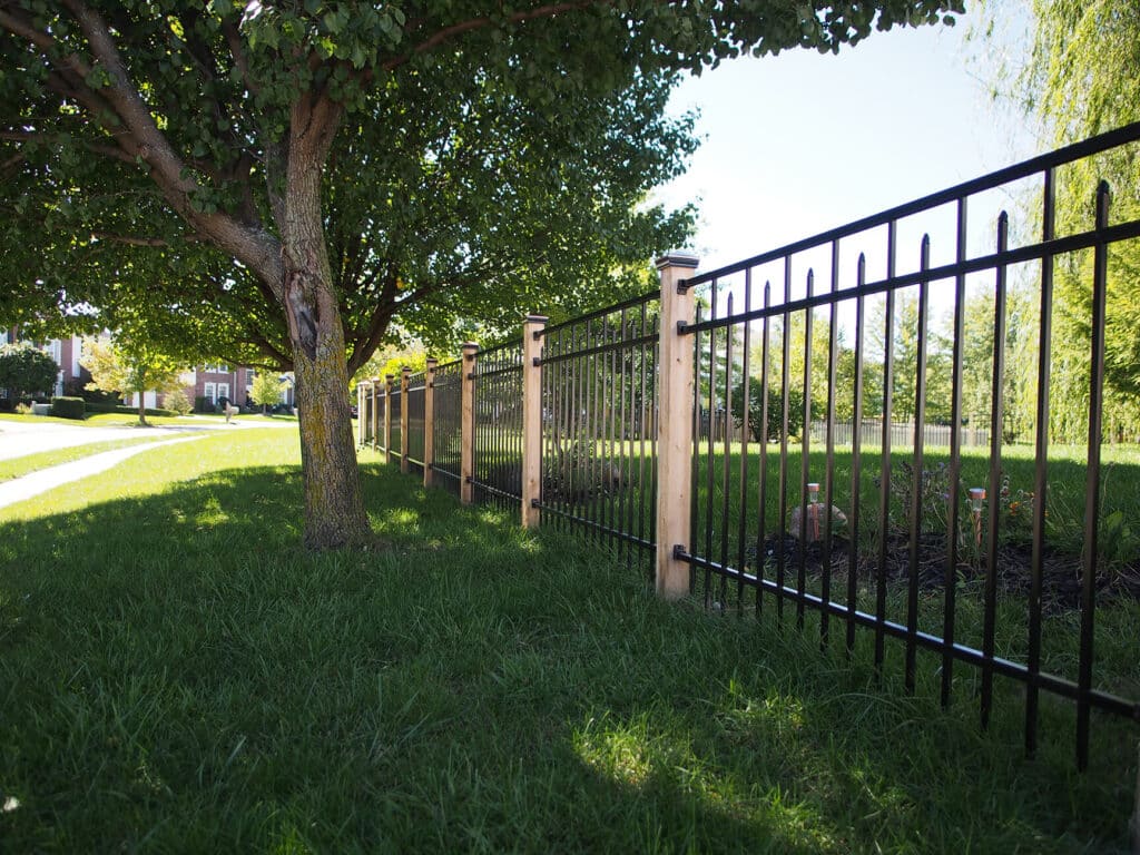 Custom aluminum fence installation with cedar posts in Fort Wayne
