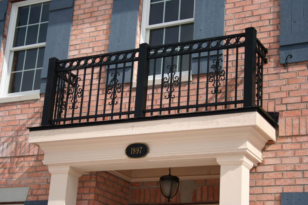 Outdoor railing installation by window in Fort Wayne