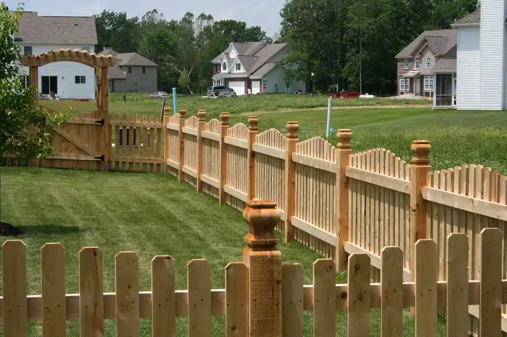 Custom wooden picket fence installation around Fort Wayne