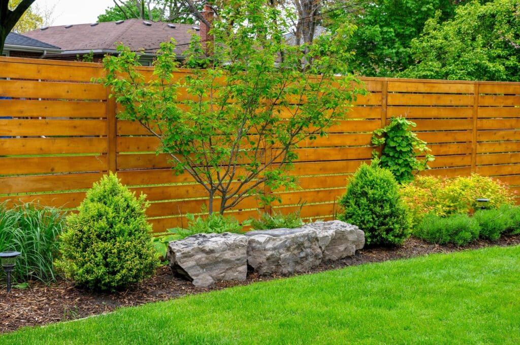 Beautiful horizontal cedar semi-private fence installation in Fort Wayne